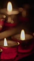 Elegant red candles with flickering flames creating soft, warm light for any occasion video