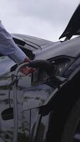 A closeup view of a modern electric vehicle charging station, showcasing its advanced features video
