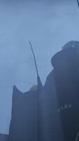 The Mysterious Silhouette of a Tower Emerges in a Foggy Atmosphere, Capturing Intrigue video