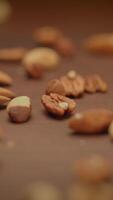 A charming mix of nuts on rustic wood, inviting and showcasing their texture and flavor video