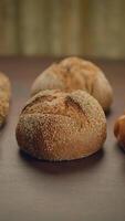 A selection of Artisan Breads beautifully arranged on a Wooden Table ready for serving video