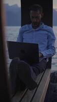 Engaging in Remote Work at Dusk by the Water, embracing tranquility and connection video