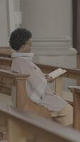 A Quiet Reflective Moment in a Church Setting Filled with the Comfort of Community Values and Faith video