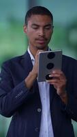 A Professional Individual Utilizing a Tablet Device in a CuttingEdge Modern Environment video