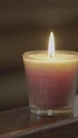Enjoy the warm candle light shimmering in an elegant glass holder, ideal for any setting video