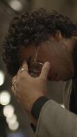 A Reflective and Contemplative Moment Captured in a Dimly Lit Atmosphere and Space video