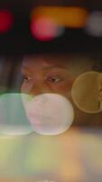 A thoughtful and reflective driver skillfully navigating a busy urban road during the night video