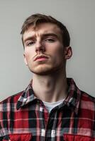 man in checkered red shirt portrait photo