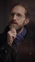 A Thoughtful Man in Dark Settings with an Introspective Mind and Profound Expressions video