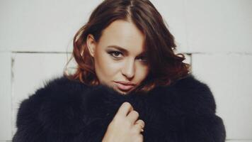 Portrait of glamour woman. Young fashionable woman posing in stylish wearing in studio video