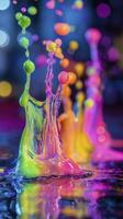 Colorful paint splashing in water creating abstract shapes photo