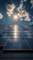 Sun shining on solar panels installed on building photo