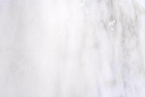 White marble texture background showing fine veins running through stone photo