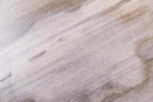 Polished marble stone surface showing natural pattern creating background photo