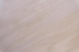Light beige marble stone surface showing interesting pattern photo