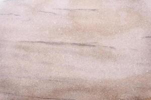 Polished stone surface showing interesting texture ideal for background photo