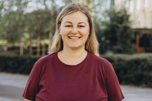 Portrait of plus size woman in casual posing at camera on the street photo