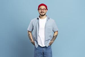 Young content designer smiling with hands in pockets photo