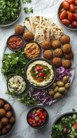Delicious mediterranean mezze platter with hummus and falafel on table photo