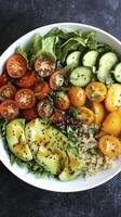 White bowl containing salad with quinoa, tomatoes, and avocado photo