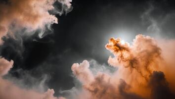 A dark sky with clouds and a bright sun photo