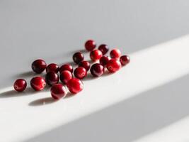 Cranberries on a white surface photo