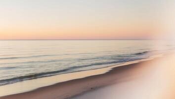 A blurry image of a beach at sunset photo