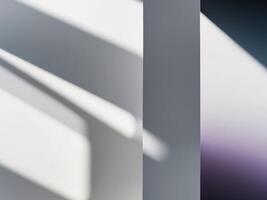 A white wall with a purple light shining through it photo