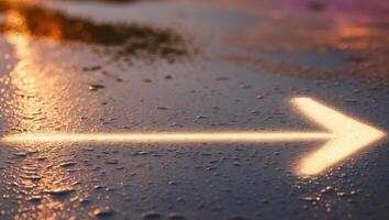 An arrow pointing in the direction of a road photo