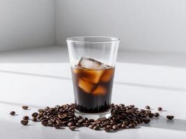 A glass of iced coffee with ice and coffee beans photo