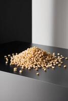 A pile of yellow corn kernels on a table photo