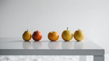 Five apples and one pear on a table photo