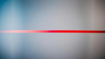 A red line on a gray background photo