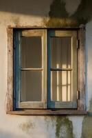 An old window with a wooden frame and a green frame photo