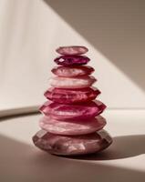 A stack of pink stones on a table photo