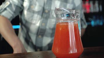 Bartender makes a refreshing lemonade. Cooking fresh juice video