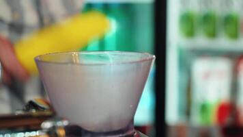 Bartender crushes ice, in the special setting. Bartender preparing cocktail. video