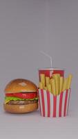 A hamburger and french fries in a paper box photo