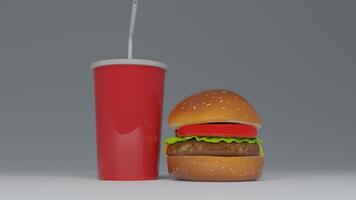 a hamburger with a drink and straw sitting on top of it photo