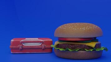 A hamburger and a suitcase on a blue background photo