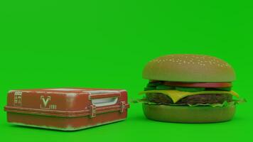 A hamburger and a box on a green background photo