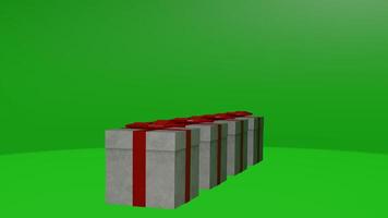 Three boxes with red bows on them on a green screen photo