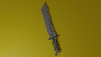 A knife is shown on a yellow background photo