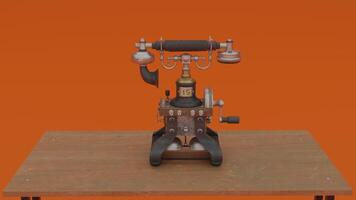 A vintage telephone on a table in front of an orange background photo