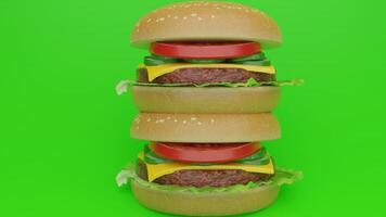 Three hamburgers stacked on top of each other on a green background photo