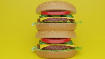 Three hamburgers stacked on top of each other on a yellow background photo