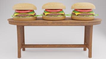 Three hamburgers on a table with a wooden base photo
