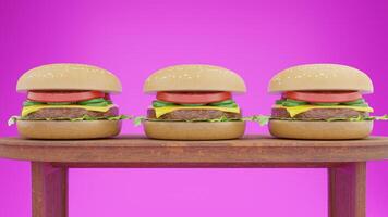 Three hamburgers on a wooden table with a pink background photo