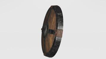 A wooden shield with a metal band on it photo