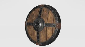 A wooden shield with metal and leather on it photo